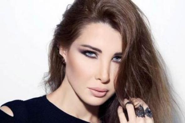 بالصور والفيديو- نانسي عجرم تحتفل مع جمهورها في مصر بألبومها "حاسه بيك" بهذه الإطلالة